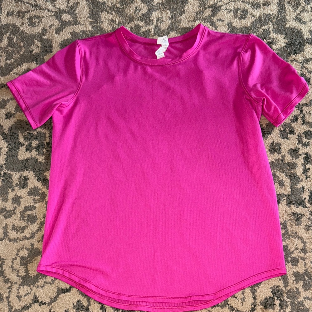 Pink Lululemon short sleeve top. 91% Polyester and 9% Lycra Elastane